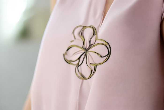 logo像一朵四瓣花的牌子女装 - logo像一朵四瓣花的牌子女装是什么